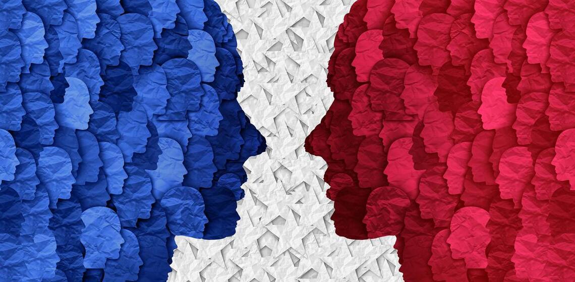 An illustration of two opposing human profiles facing each other.